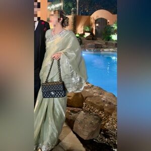 Elegant Olive Green Saree with Silver Embellishments